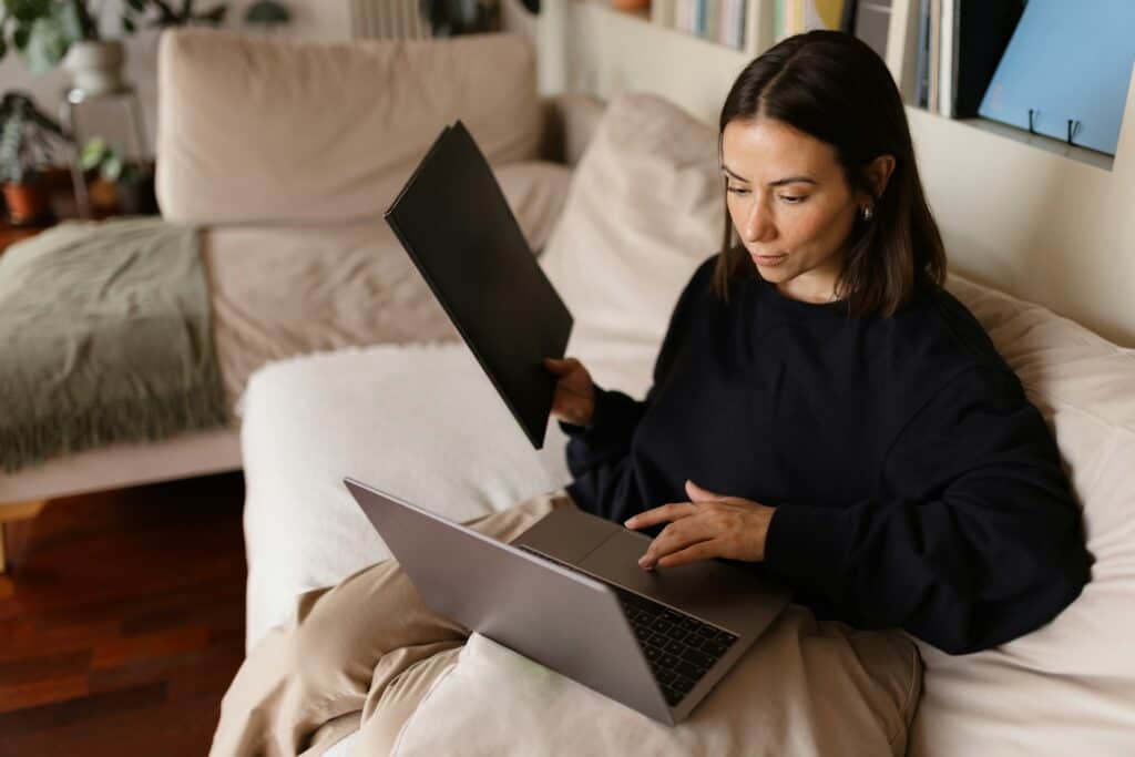 Woman working on legal documents at home for divorce or separation.
